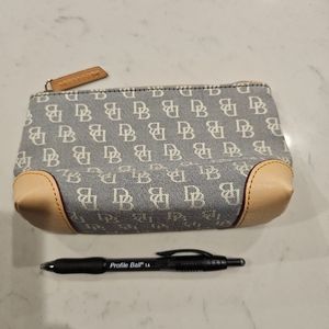 Dooney and Burke gray white new never been used small make up bag/satchel